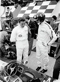Jim Clark and Graham Hill with Lotus 49 during 1967 British Grand Prix Jim Clark and Graham Hill with Lotus 49 during 1967 British Grand Prix