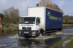 Driving Prints: Lorry driving on flooded road