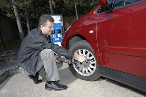 2008 Prints: Man inflating car
