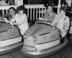 Racing drivers Graham Hill and Jim Clark enjoying a dodgem ride Racing drivers Graham Hill and Jim Clark enjoying a dodgem ride